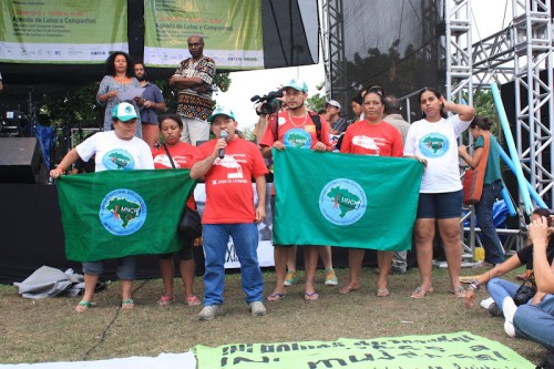MNCR and Red Lacre leaders stating demands at the summit-wide assembly.
