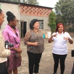 Maria Mônica da Silva, waste picker at CooperLimpa cooperative, speaks with the South African delegation (Nolwazi Cobbinah, Mamosa Afrika, Pamela Nyuswa) and Diadema government officials. Photo credit: WIEGO.