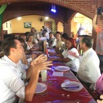 Nolwazi Cobbinah speaks with Diadema Mayor Lauro Michel during lunch. Photo credit: WIEGO.