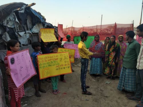 Poster display and steps of hand washing demonstration done by children at Sihani, Ghaziabad to spread awareness on prevention of coronavirus.