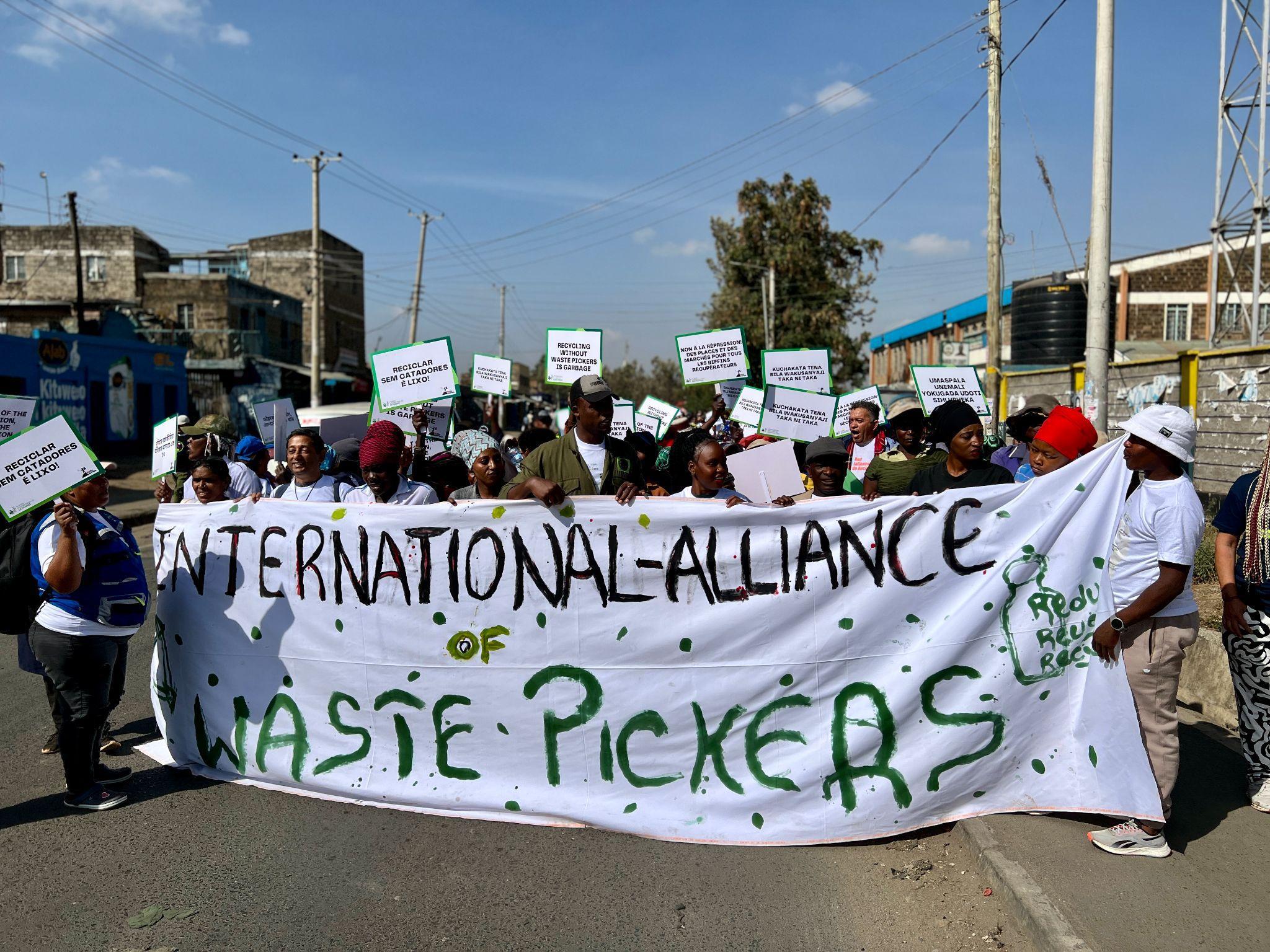 Waste pickers during their march around the Dandora Dumpsite, in Nairobi, Kenya, to commemorate the International Waste Pickers Day